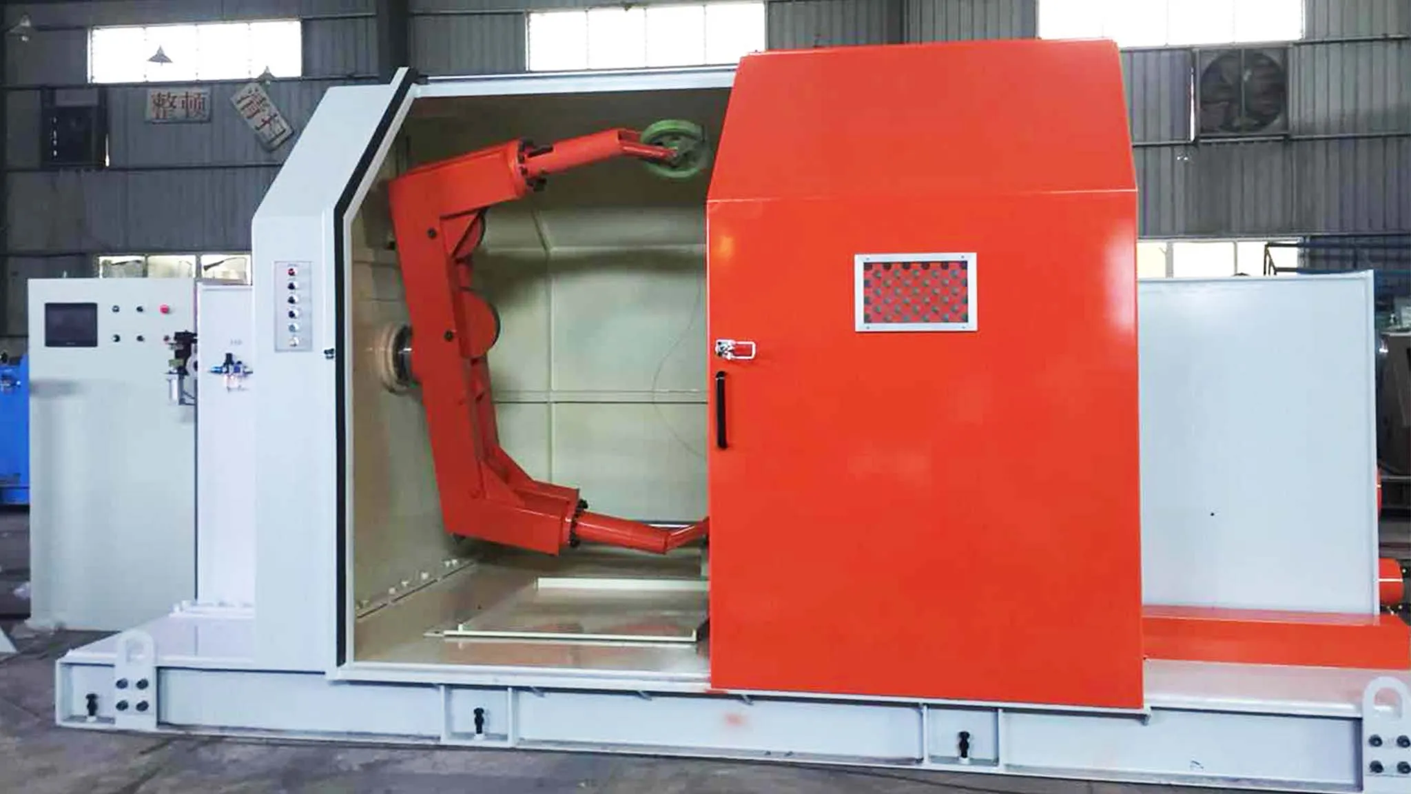 A 630 Cantilever Single Twisting Machine with an orange - and - white industrial enclosure. The open side exposes a red cantilever - mounted twisting arm mechanism, tailored for high - efficiency cable twisting in wire manufacturing. A control panel featuring a digital screen and operation buttons is visible on the left, facilitating precise process control.